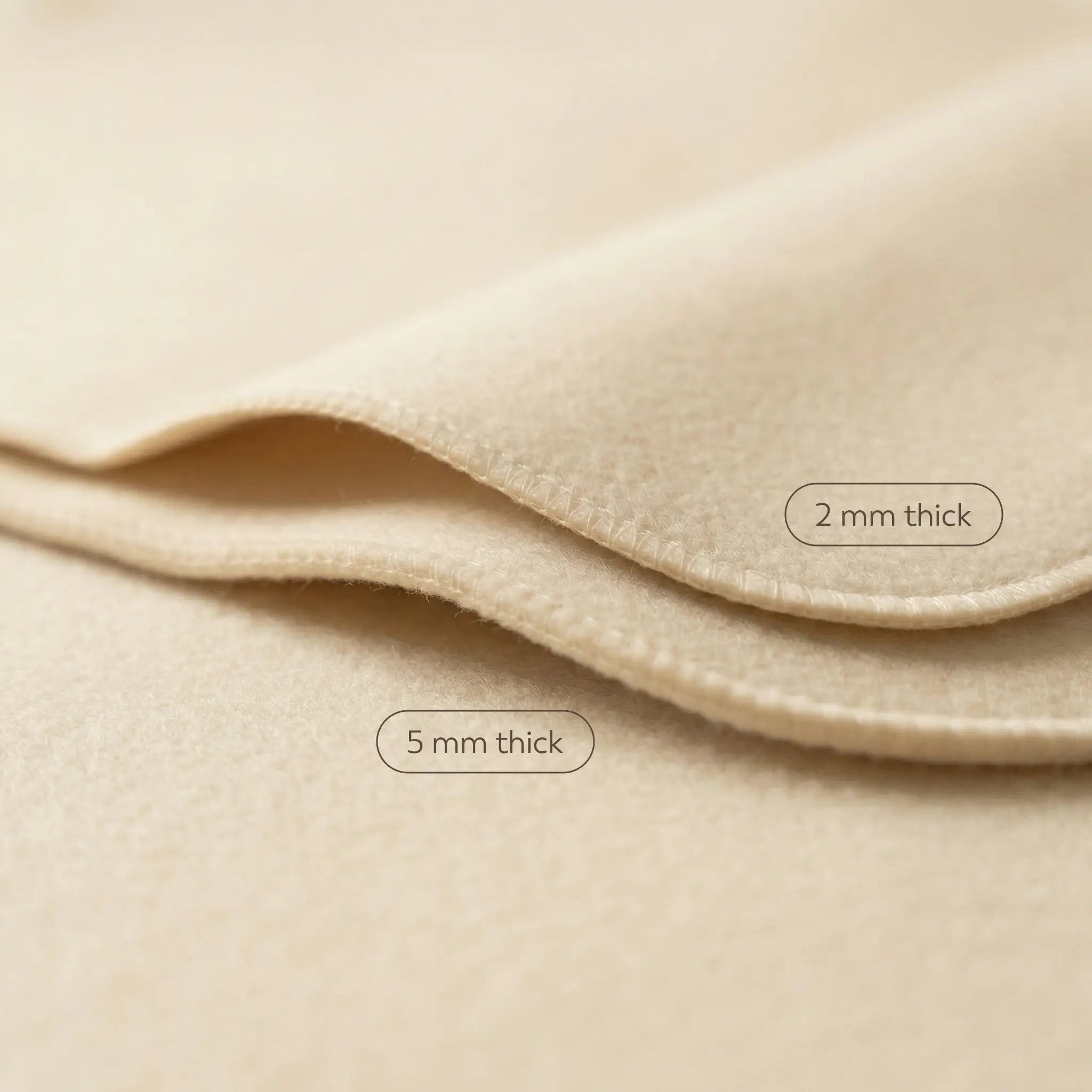 Natural wool sauna mat comparison showing 2mm and 5mm felt thickness options for sauna and banya use