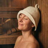 Wearing wool sauna hat in a sauna