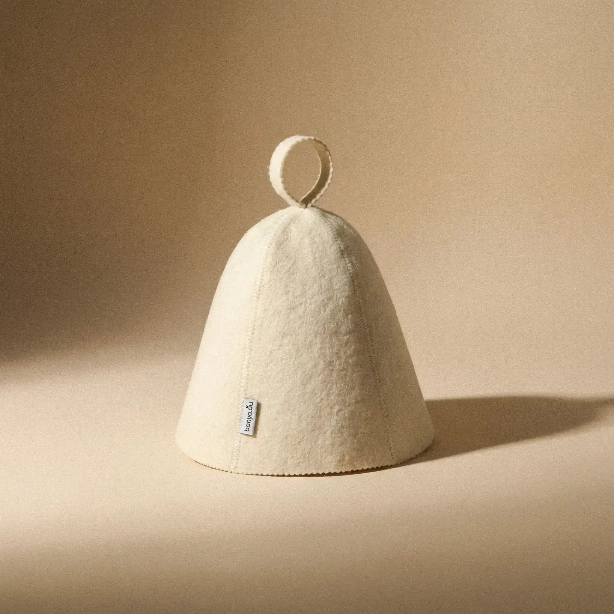 Traditional wool sauna hat made from natural wool felt with hanging loop